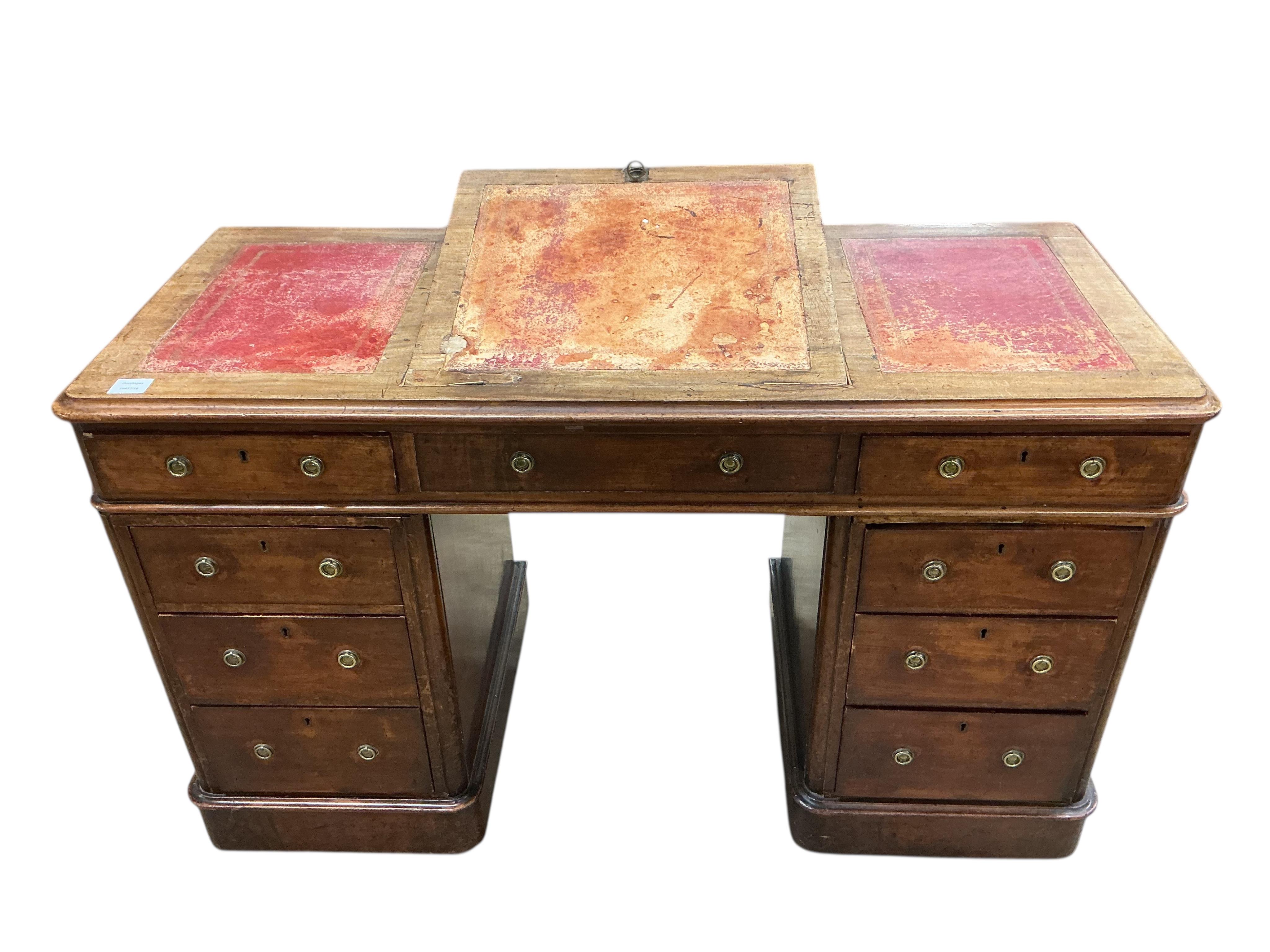 A Victorian mahogany pedestal desk, the top with hinged central section, width 122cm, depth 53cm, height 78cm